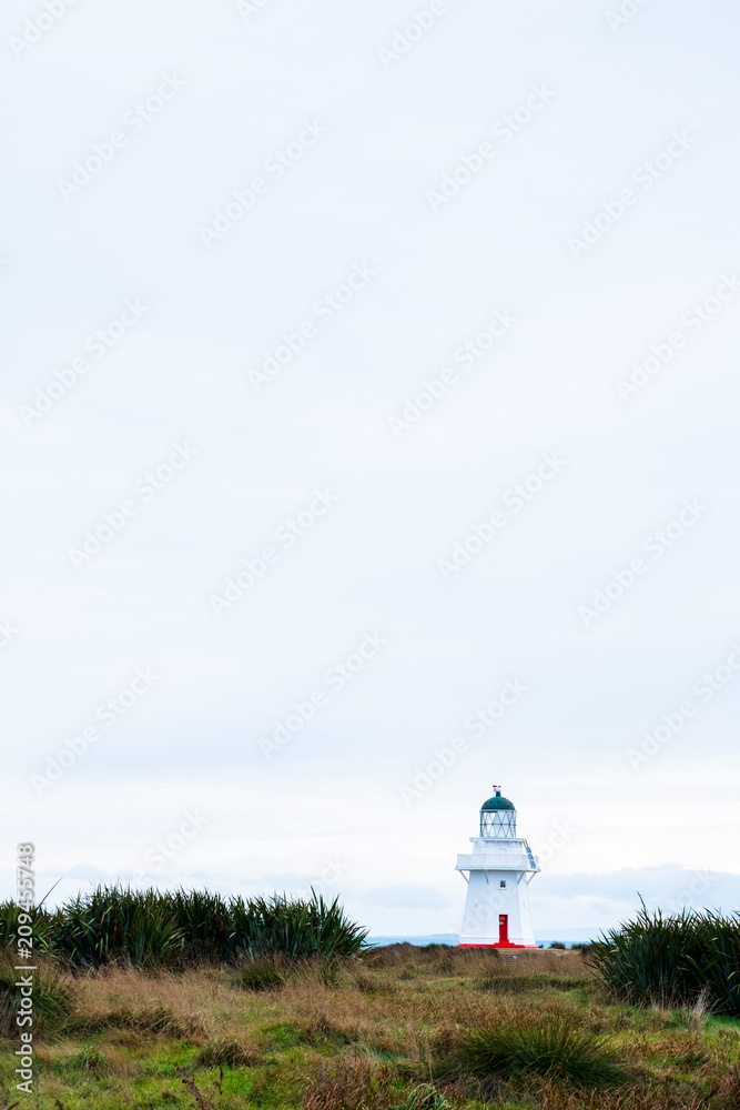 Waipapa point, the lighthouse, ocean and cloudy. Waipapa point, the lighthouse, ocean and cloudy.