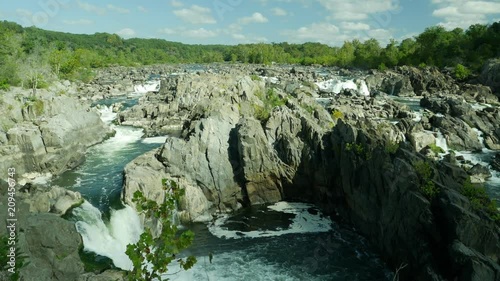 Eagle flying over Great Falls of Potomac river