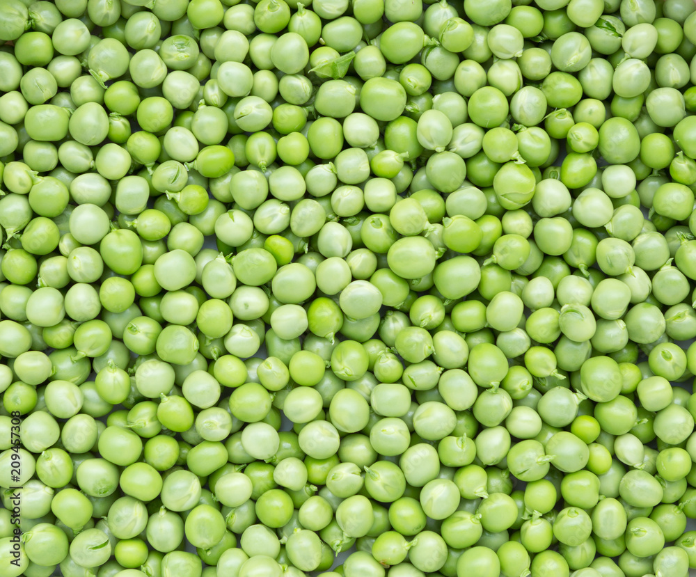 Green peas background texture top view.