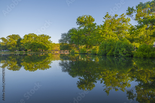 Beautiful view reflection of trees in Sunset Lake located in Asbury Park, New Jersey