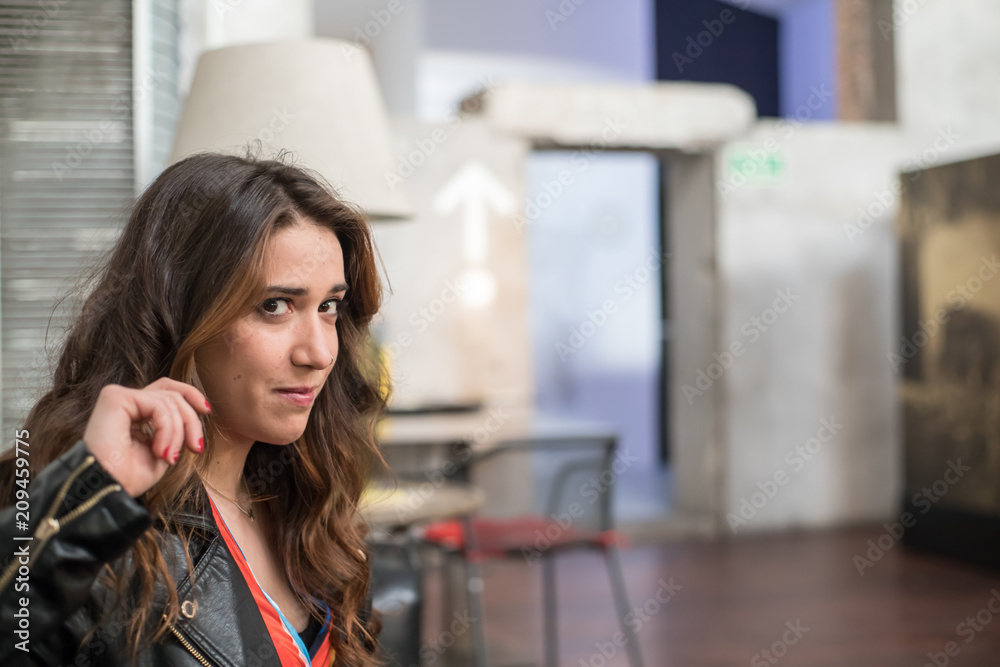 portrait of pretty long-haired woman in a bar portrait of pretty long-haired woman in a bar