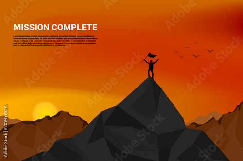 PriSilhouette of a business man on top of mountain: concept of success in career and missionnt