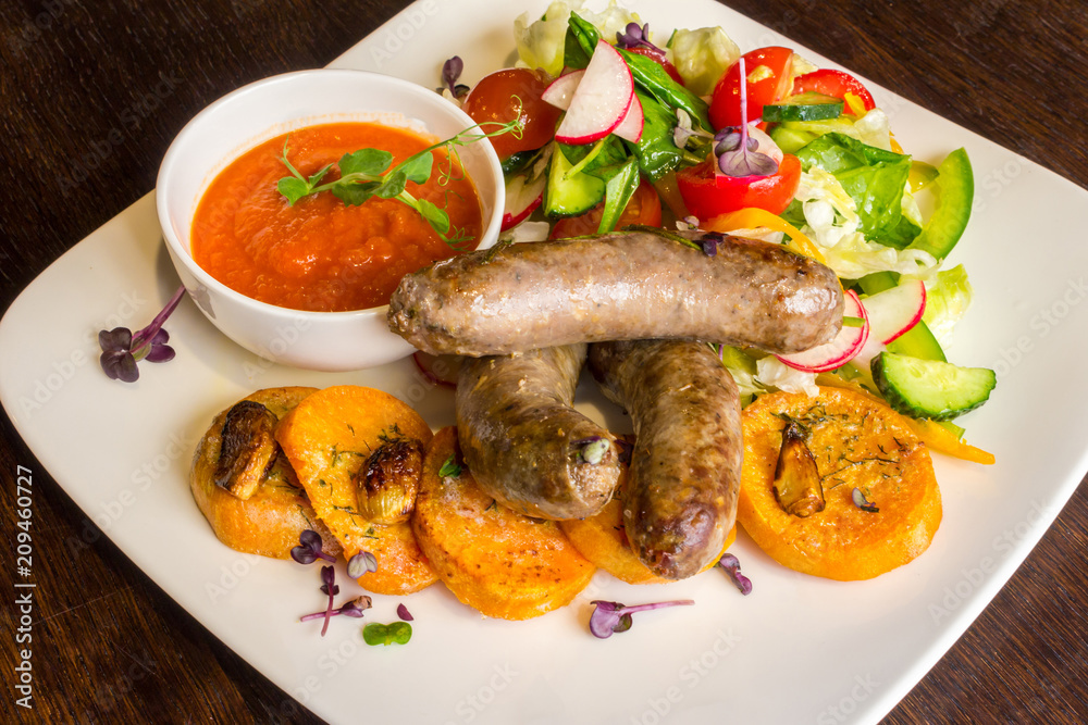 Fried sausages and salad