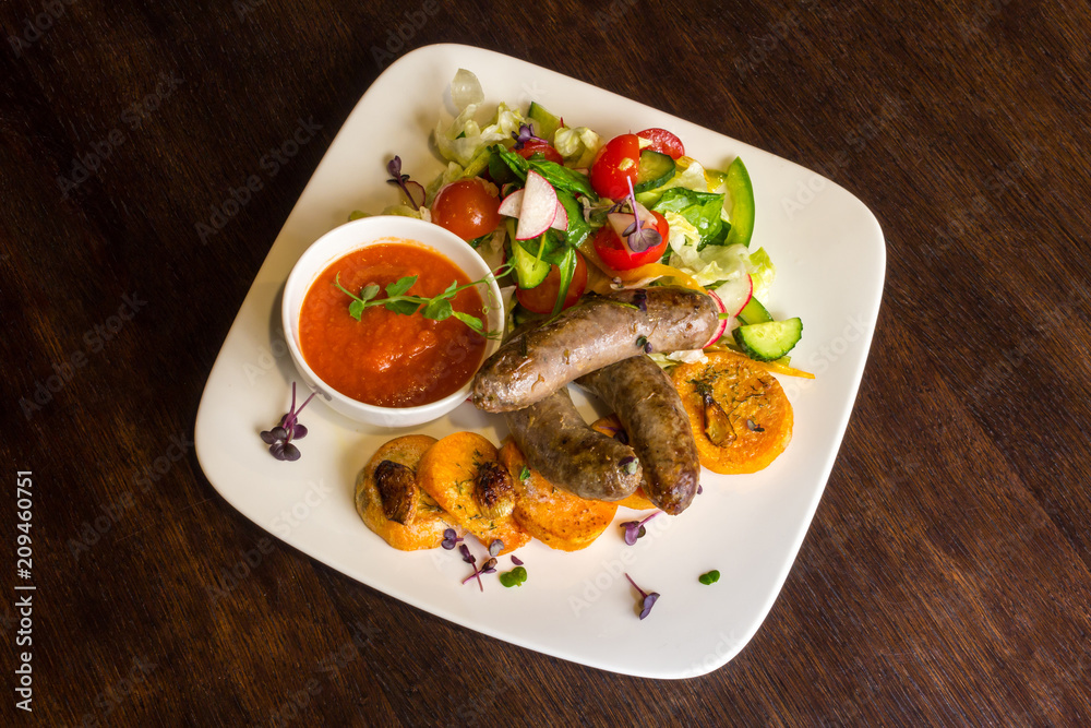 Fried sausages and salad