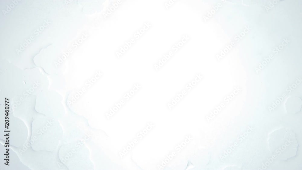 ice cubes on white moving with backlight ice cubes on white moving with backlight