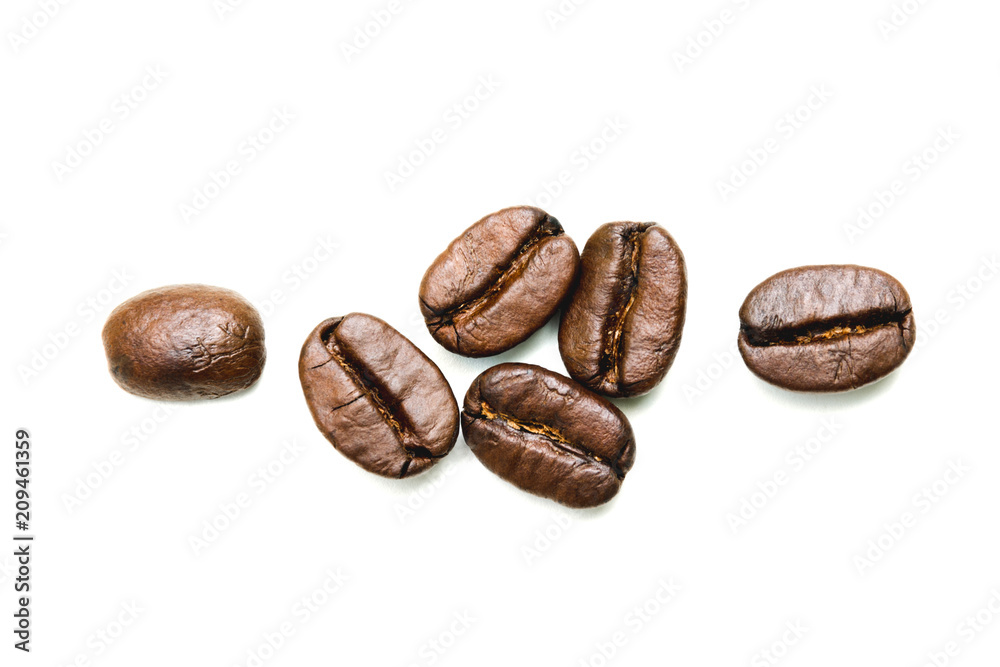 Close up coffee beans isolated on a white background. Close up coffee beans isolated on a white background.