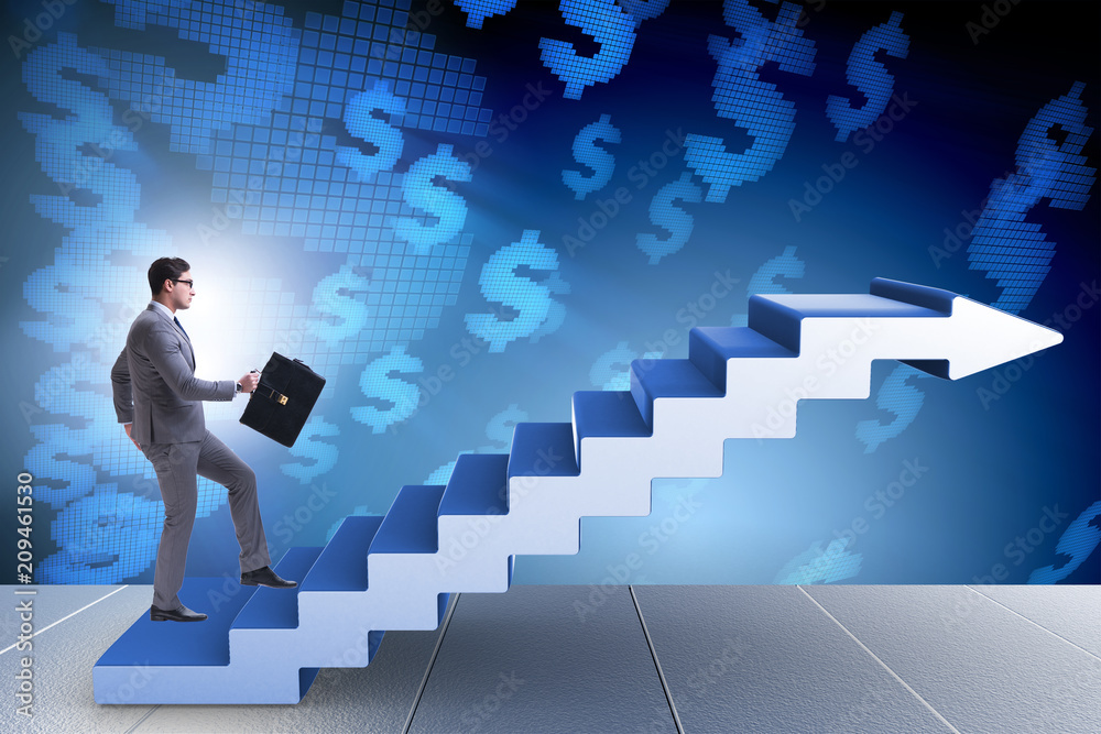 Businessman climbing career ladder in business concept Businessman climbing career ladder in business concept