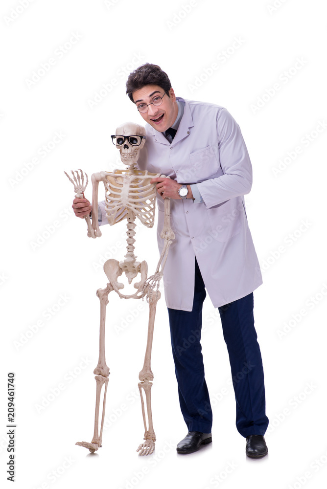 Naklejka premium Young doctor with skeleton isolated on white