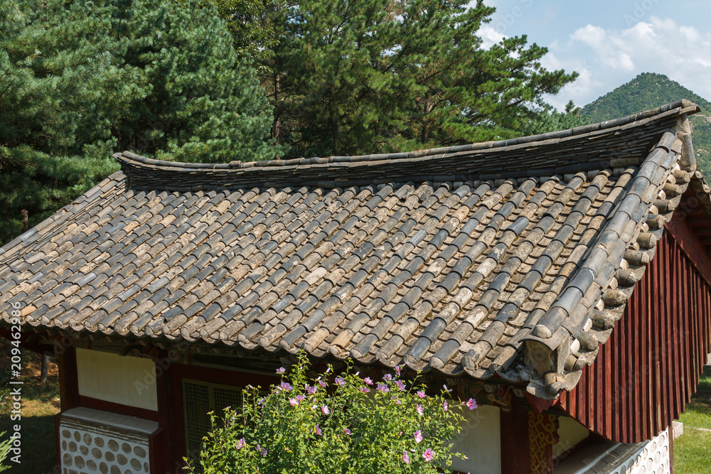 wooden building with a roof made of tile near the Tomb of King Kongmin, a 14th-century mausoleum located in Haeson-ri, Kaepung County, outside of the city of Kaesong, North Korea.
