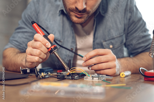 Engineer Working On Circuit Board photo