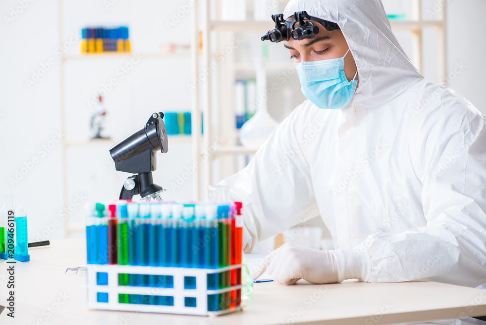 Young chemical scientist working in lab Young chemical scientist working in lab