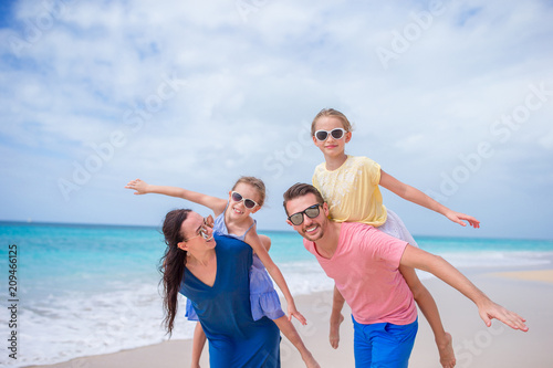 Happy beautiful family on the beach