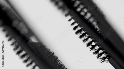mascara brushes macro on white moving many brashes photo