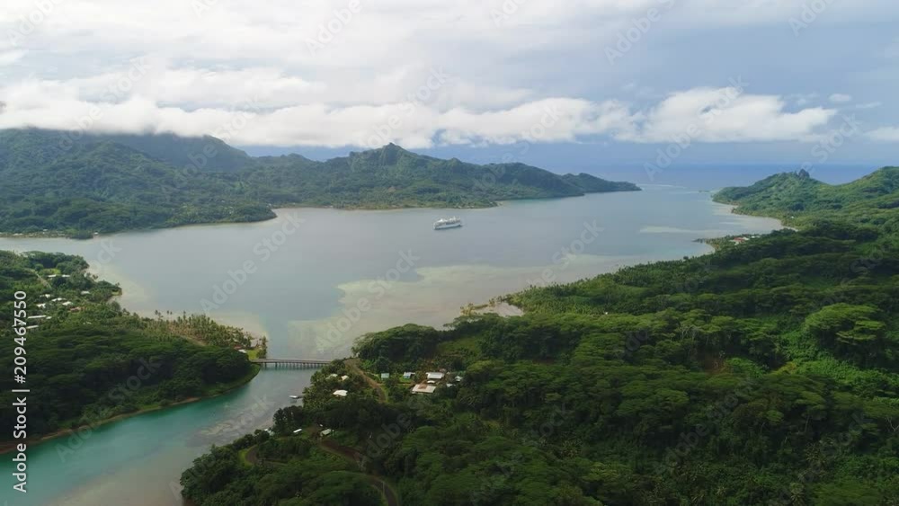 Aerial panoramic view of tropical paradise of Huahine island, Maroe Bay, slopes of hills covered in lush green rain forest - South Pacific Ocean, panorama landscape of French Polynesia from above Aerial panoramic view of tropical paradise of Huahine island, Maroe Bay, slopes of hills covered in lush green rain forest - South Pacific Ocean, panorama landscape of French Polynesia from above