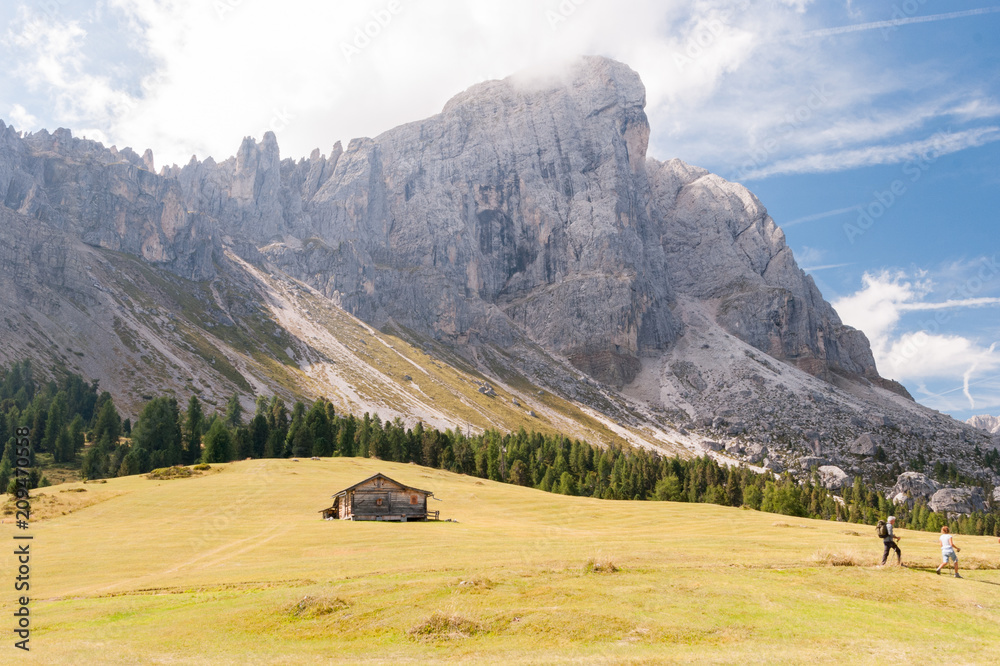 St. Magdalena, Italy - August 2, 2015: Family takes an excursion to the base of the Dolomites