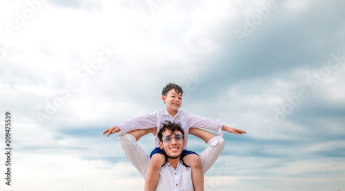portrait happy family mom dad and son playing together