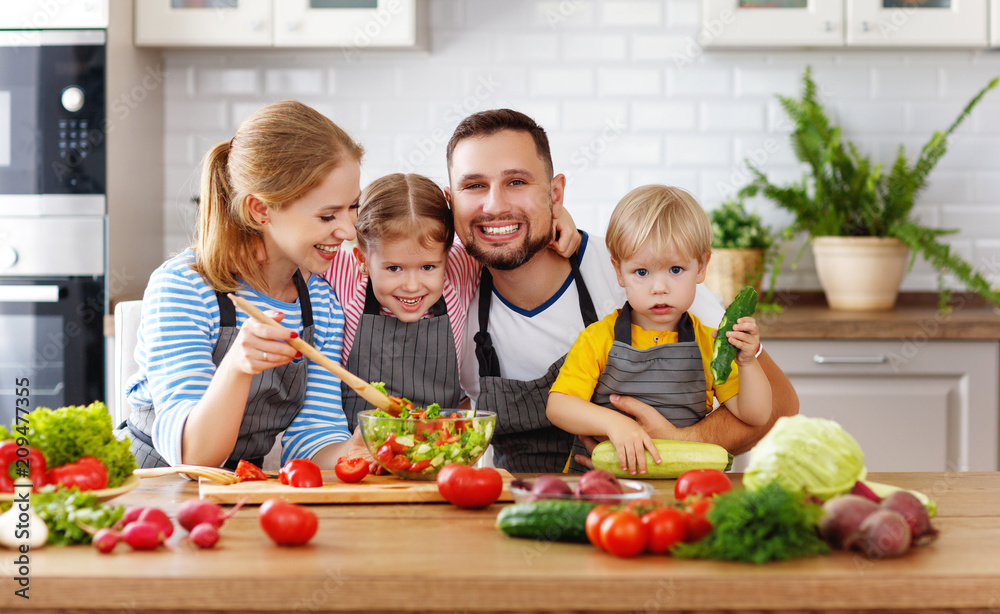 appy family with child preparing vegetable salad appy family with child preparing vegetable salad