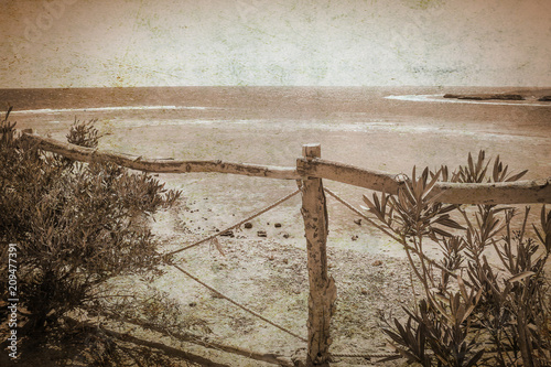 old photo Stylishly beautiful fence on sea landscape background
