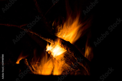 Campfire burning at night long exposure close up