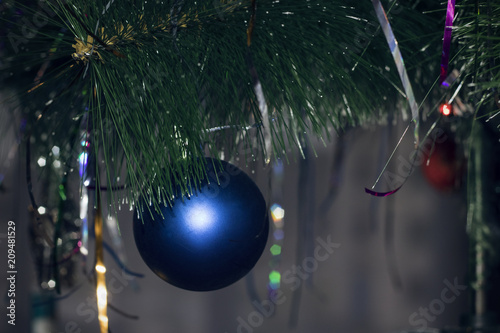 Blue fur-tree toy on a Christmas tree