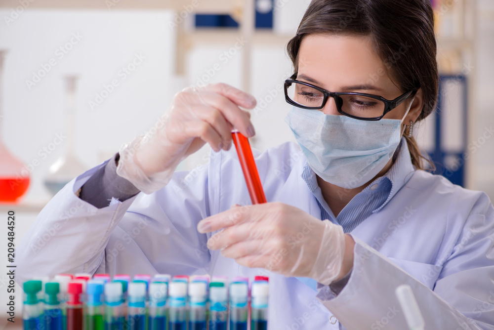 Female chemist working in hospital lab Female chemist working in hospital lab