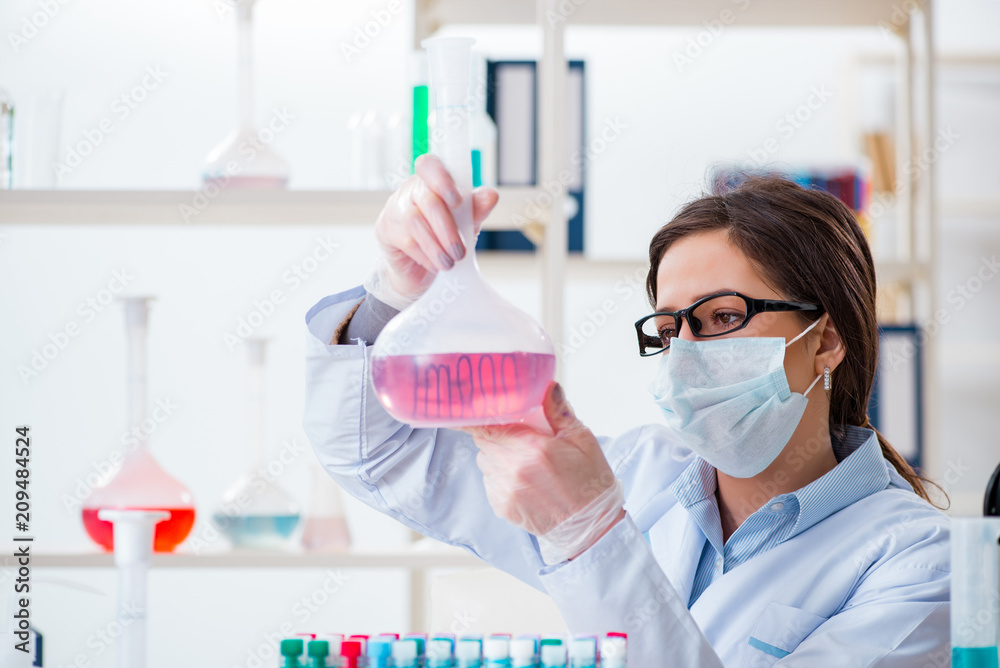 Female chemist working in hospital lab Female chemist working in hospital lab