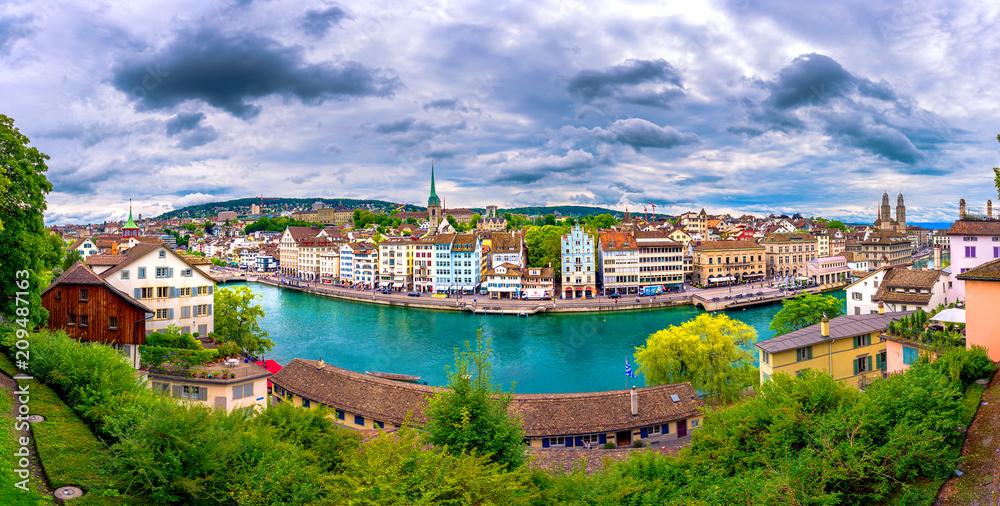 Panoramic view of historic Zurich city center with famous Fraumunster, Grossmunster and St. Peter and river Limmat at Lake Zurich, Canton of Zurich, Switzerland