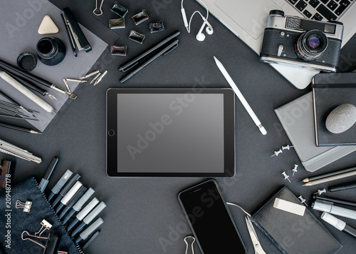 Modern learning concept. View from above in monochrome colors on black background.