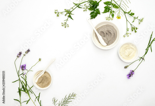 Natural cosmetics concept with various kinds of cosmetic clays and herbs