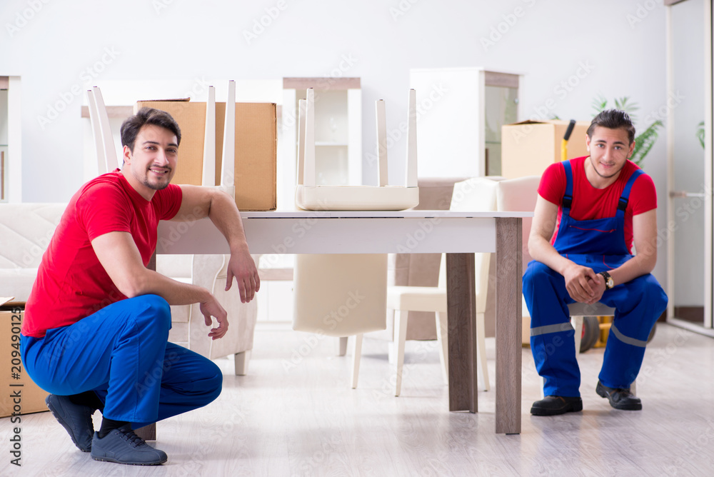 Two contractor employees moving personal belongings Two contractor employees moving personal belongings