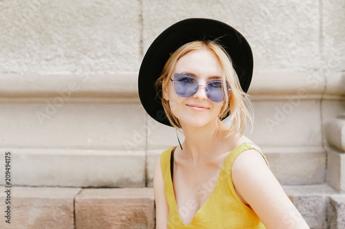 Beauty woman hipster in a long yellow dress. Street fashion © Felix