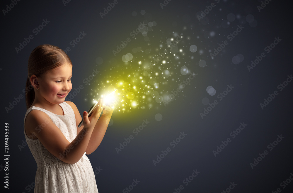 Little cute girl playing on sparkling tablet
Little cute girl playing on sparkling tablet
