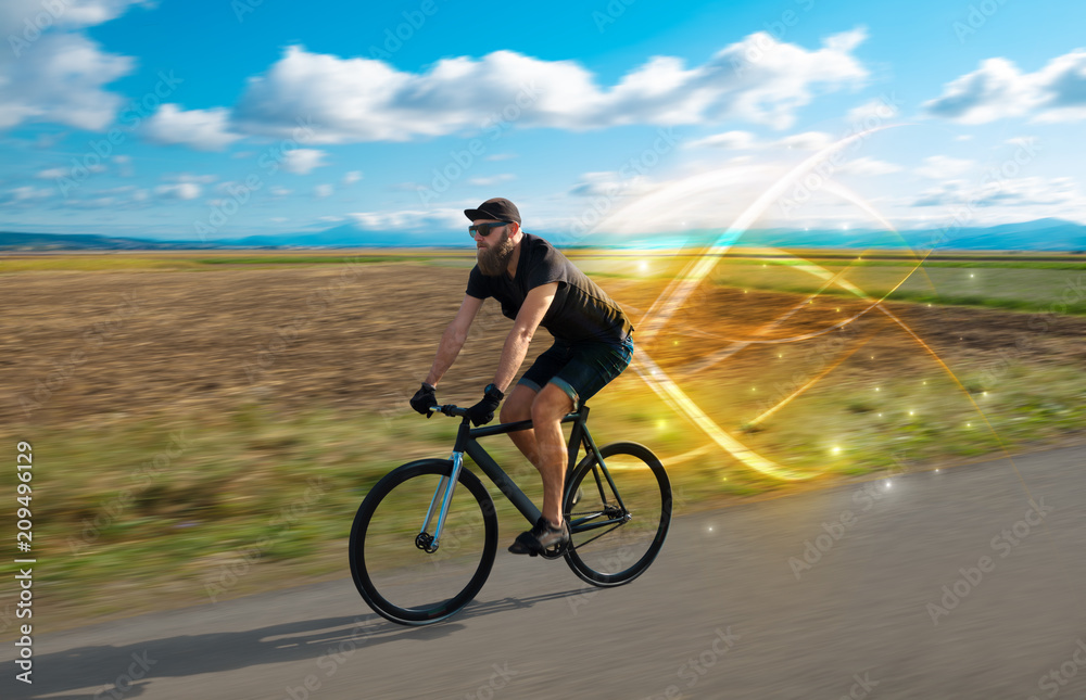Young cyclist riding bicycle with magical landscape and concept Young cyclist riding bicycle with magical landscape and concept