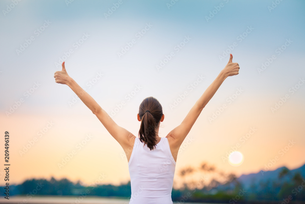 Young woman feeling happy and positive. Motivational concept.  - obrazy, fototapety, plakaty 