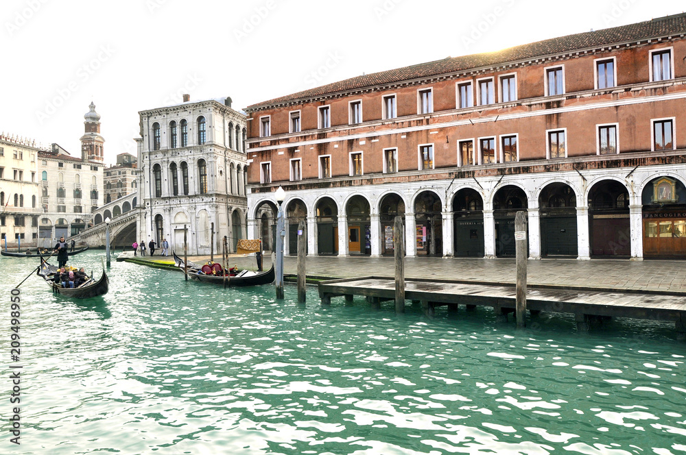 Angled view of Gothic building on The Grand Canal with Gondola. Venice, Italy.