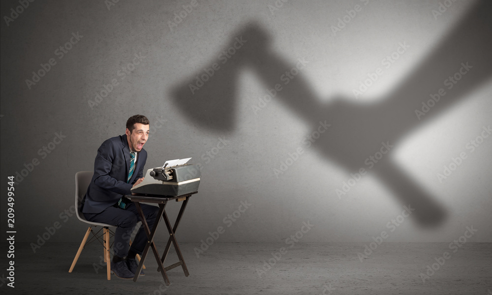 Shadow threatening hard worker man who is afraid
Shadow threatening hard worker man who is afraid