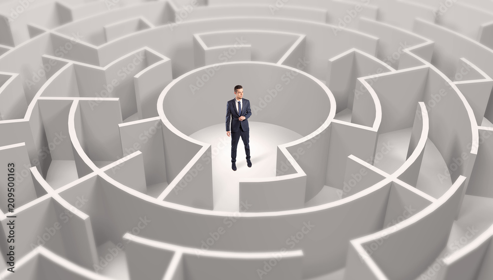 Young businessman standing in a middle of a 3d round maze
Young businessman standing in a middle of a 3d round maze