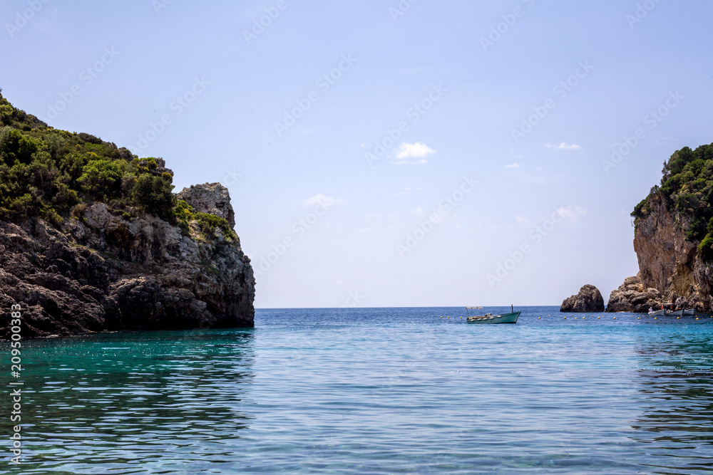 Beautiful rock formation islands or islet surrounded by very stunning blue water. Tourist boats and yachts were all around the area to enjoy and have a splash into the beach under a sunny day. Beautiful rock formation islands or islet surrounded by very stunning blue water. Tourist boats and yachts were all around the area to enjoy and have a splash into the beach under a sunny day.
