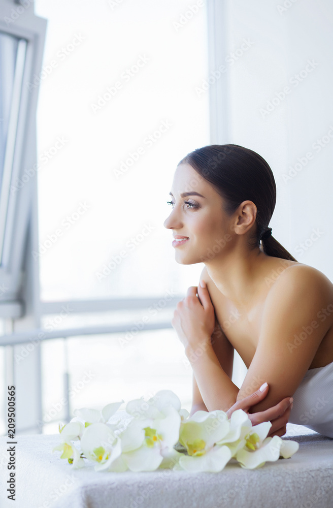 Beauty and Care. Beautiful Woman in Spa Salon. Young Girl Watches the Window and Relaxes. Girl with Beautiful and Pure Skin. High Resolution Beauty and Care. Beautiful Woman in Spa Salon. Young Girl Watches the Window and Relaxes. Girl with Beautiful and Pure Skin. High Resolution