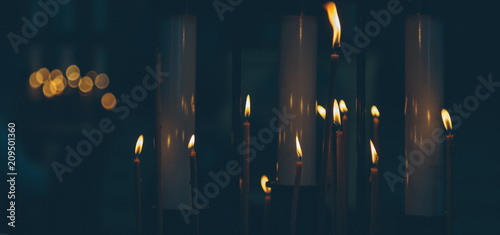 lighted candles in the church close-up