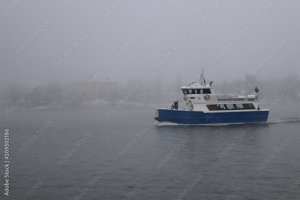 Ferry in winter mist
