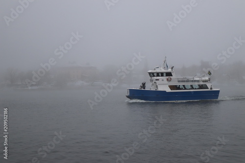 Ferry in winter mist
