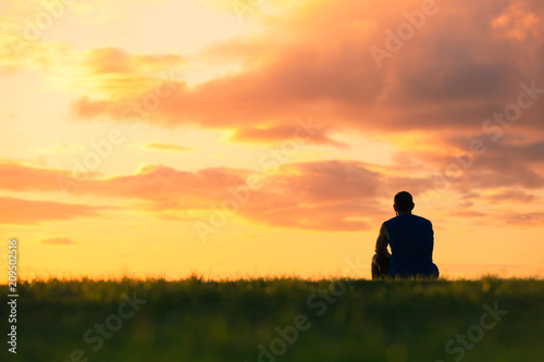 Alone man watching the sunset. 