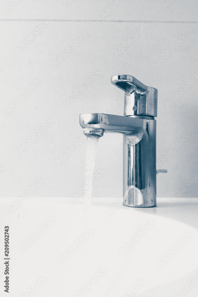 faucet with flowing water in wash sink faucet with flowing water in wash sink