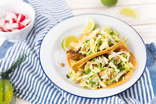 Homemade Tacos Served on Plate with Lime and Fresh Radishes