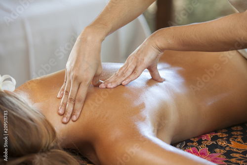 Young woman relaxing after massage on spa treatment