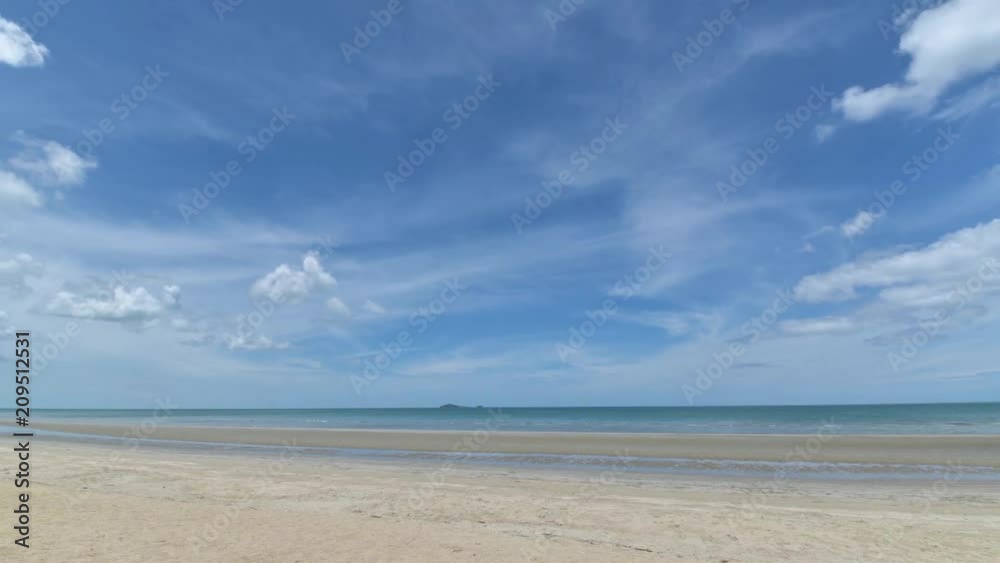 Idyllic tropical beach with white sand shore of summer day in Thailand. Idyllic tropical beach with white sand shore of summer day in Thailand.