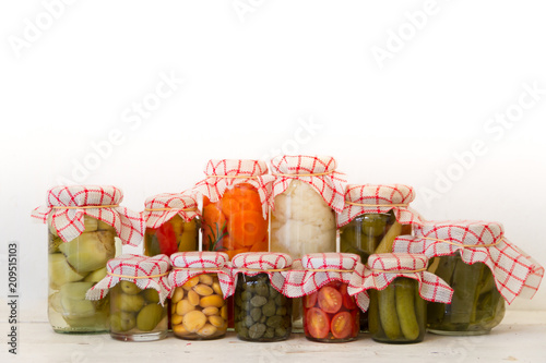 variety of jars with organic vegetable pickles