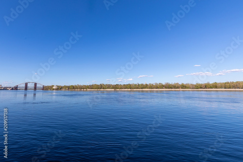View with blue deep river and horizon line