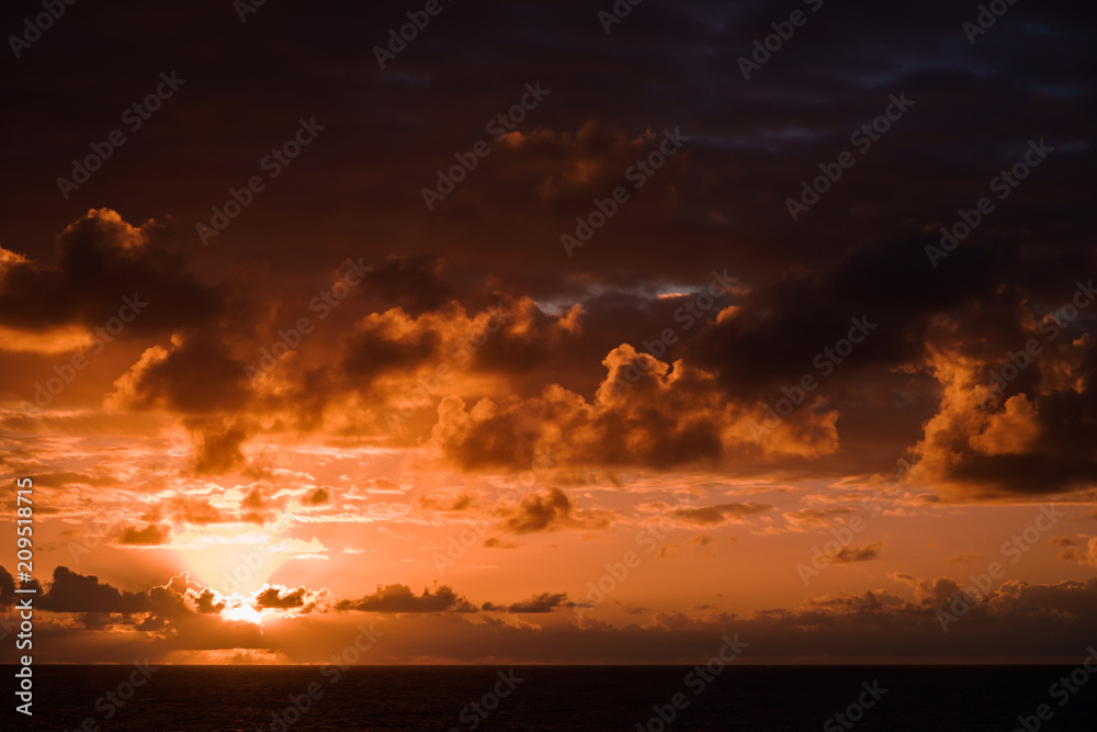 Beautiful sunset in atlantic ocean with amazing clouds